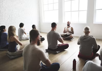 A guided group meditation session indoors